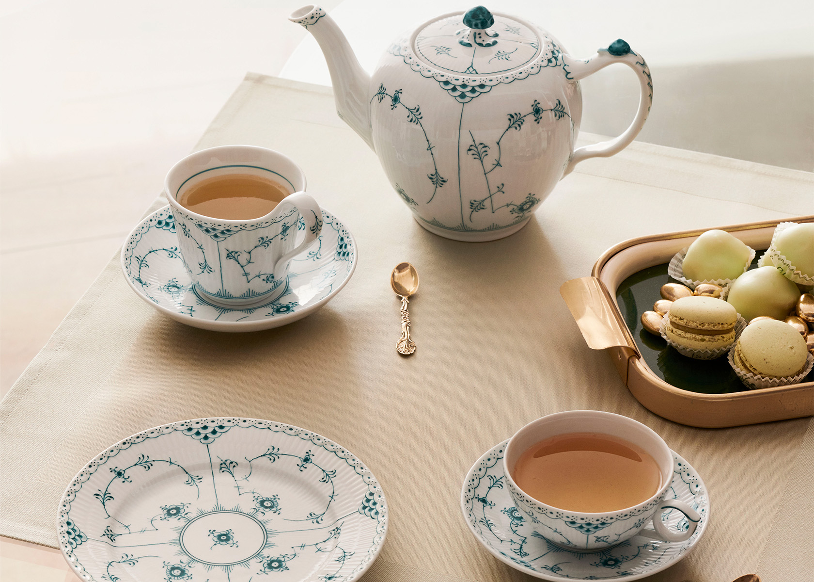 The handcrafted and hand-painted Emerald Fluted Half Lace complete tea set with teapot, sugar bowl teacup with saucer and coffee cup with saucer and dessert plates